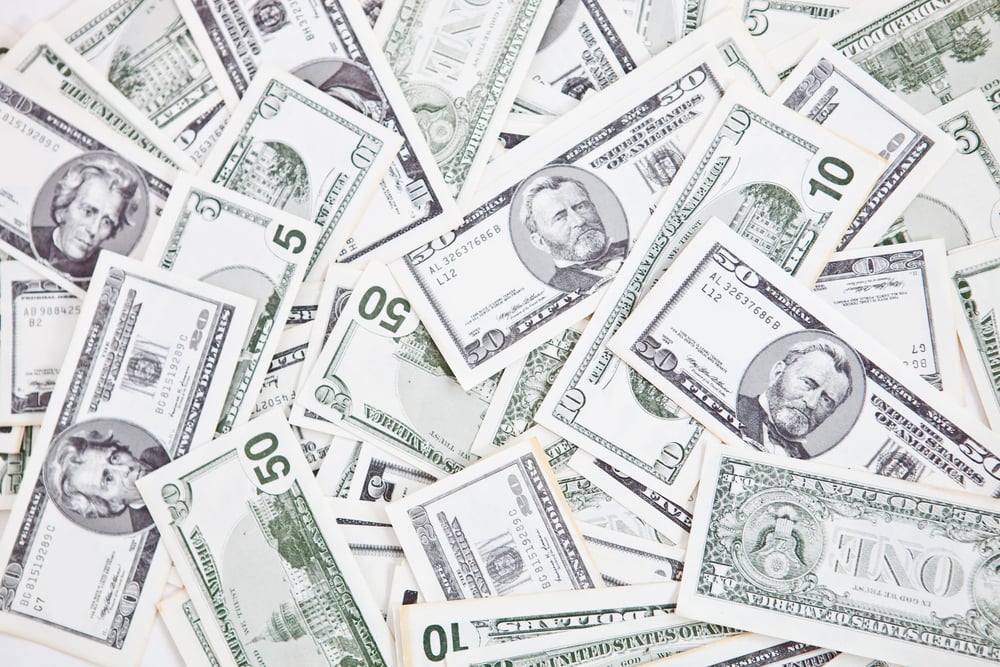Closeup to a bunch of dollar bills - money concepts